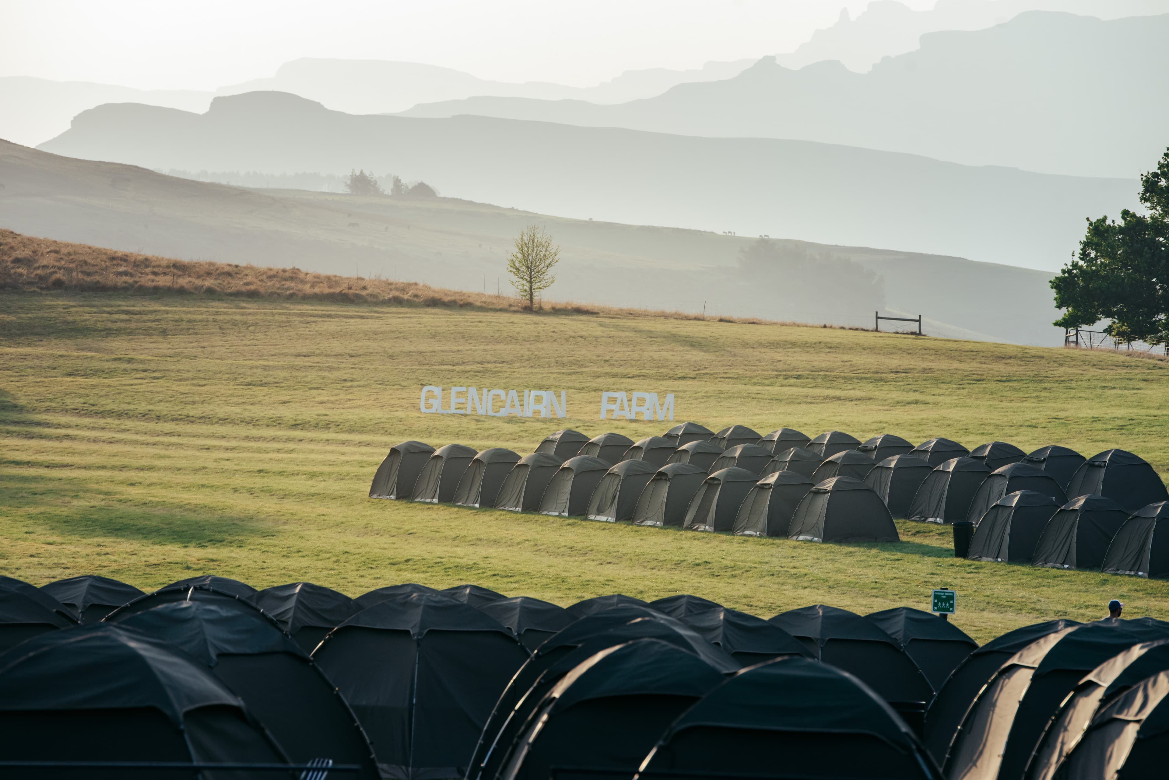Glencairn Farm tents with misty mountains