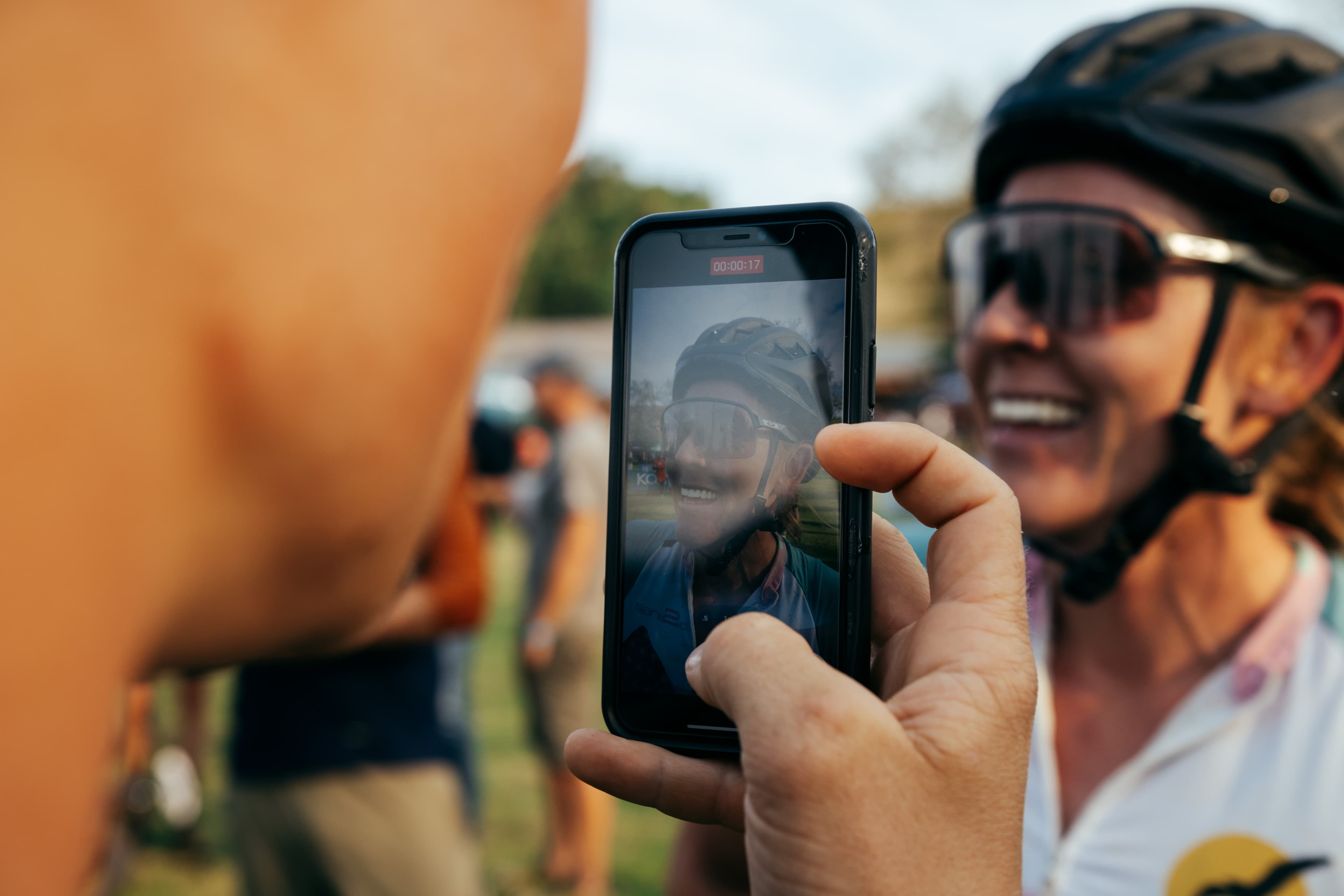 Rider celebrating with phone closeup
