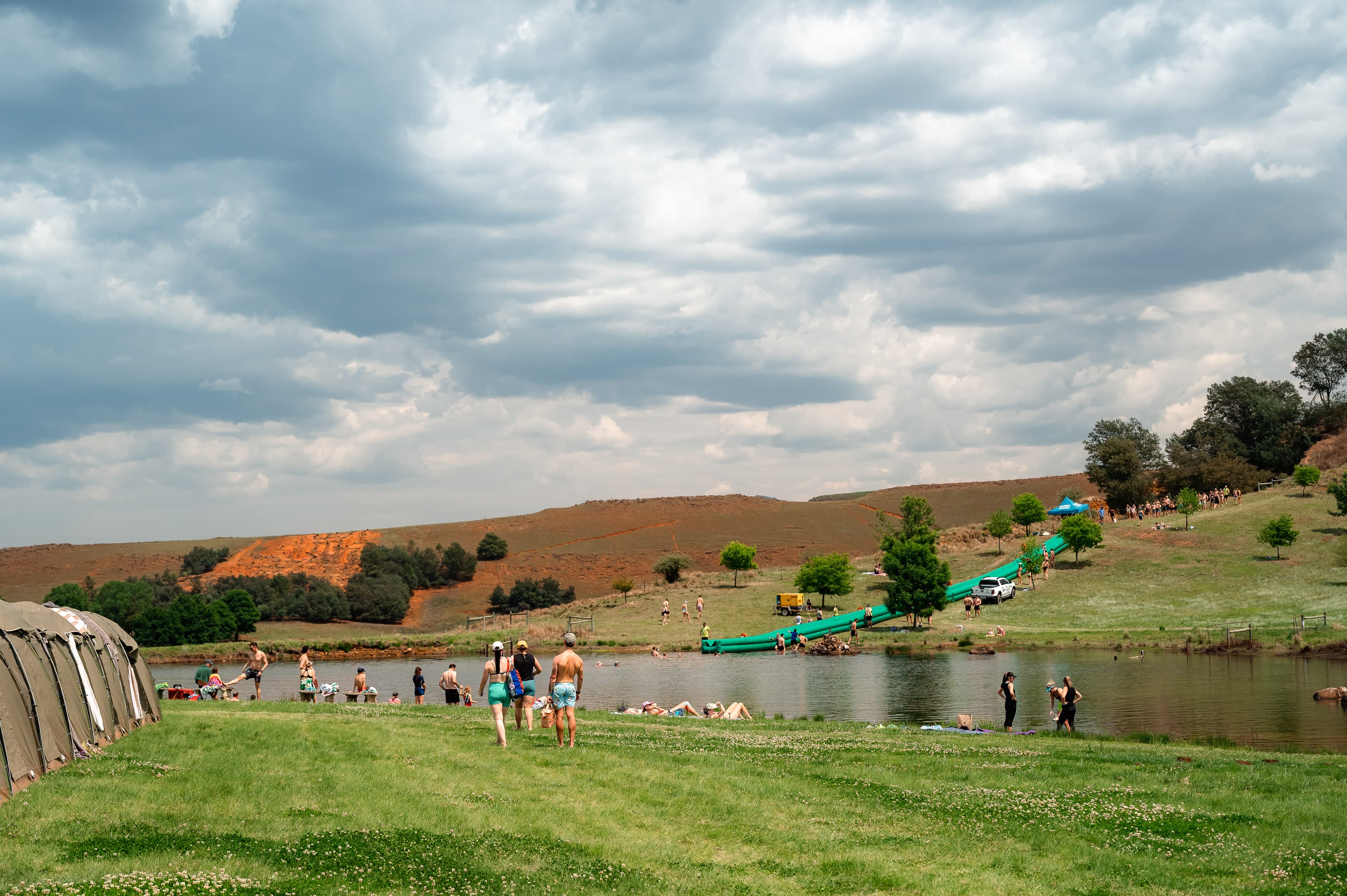 Wide view of waterslide and dam at race village